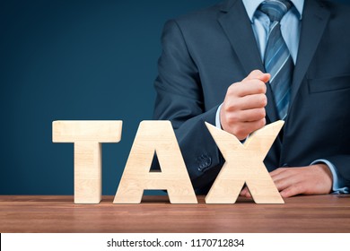 Tax Reduction Business And Financial Concept. Angry Businessman Try To Destroy Text Tax.