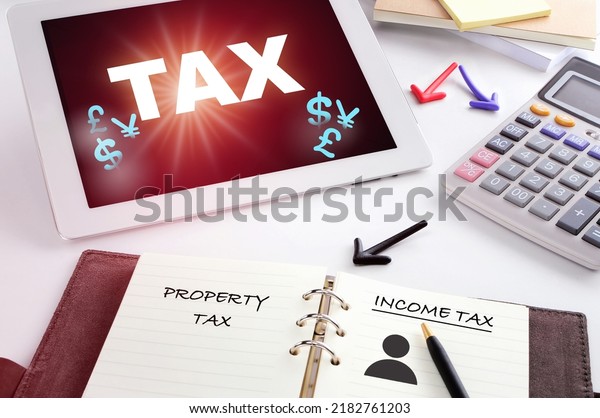 Tax refund and calculator with currency on\
computer digital tablet. Cost and Expenses of business for return\
tax and vat concept