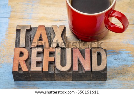 tax refund - word abstract in vintage letterpress wood type blocks with a cup of coffee