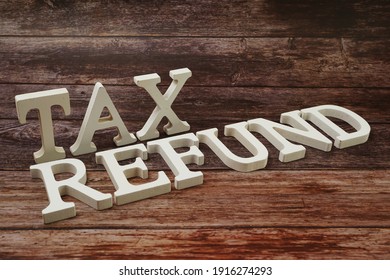 Tax Refund Word alphabet letters on wooden background