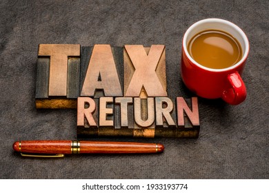tax return  banner - word abstract in vintage letterpress printing blocks against textured paper with a cup of coffee, business financial concept