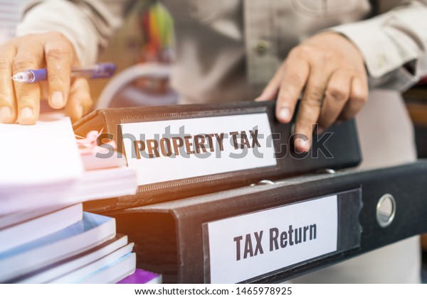 tax-return-property-tax-folders-stack-stock-photo-1465978925-shutterstock