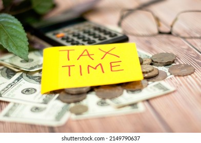 Tax Season Prepare Individual Income Tax Return Horizontal Top View Tax Time Reminder Attached On Bank Notes  Coins Eyeglasses Calculator On The Wooden Table - Image