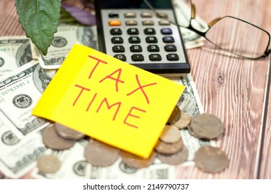 Tax Season Prepare Individual Income Tax Return Horizontal Top View Tax Time Reminder Attached On Bank Notes  Coins Eyeglasses Calculator On The Wooden Table - Image