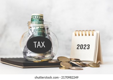 Tax Time In 2023. Glass Money Box With Money