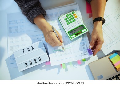 tax time. accountant woman working with documents in office. - Shutterstock ID 2226859273