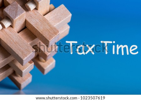 Tax Time - brean teaser or puzzle with notification of the need to file tax returns, tax form