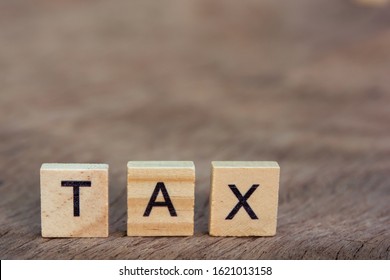 Tax Word On Wooden Blocks Calculator Stock Photo (Edit Now) 2121013418