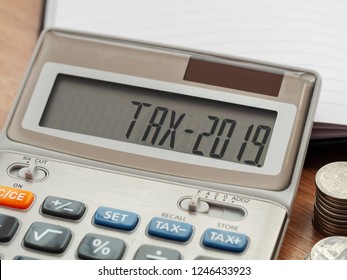 Tax word and 2019 number on calculator. Business and tax concept. Pay tax in 2019 years.