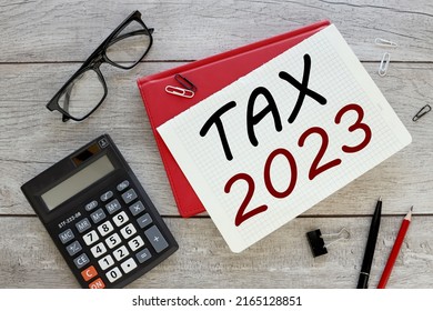Taxes 2023 red notepad with text on the table - Shutterstock ID 2165128851