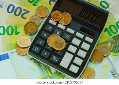 Taxes In EU Countries. Recalculation Of Money. Expenses And Incomes In European Countries.Calculator And Euro Coins On Banknotes Background.Euro Currency.Budget Allocation.