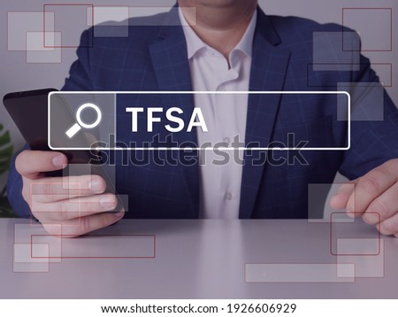 Tax-Free Savings Account TFSA phrase on the screen. Loan officer use cell technologies at office. Concept search and Tax-Free Savings Account TFSA . The TFSA program began in 2009
