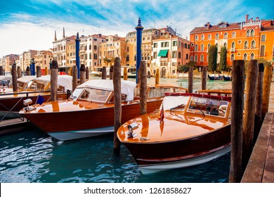 Taxi boat waiting for tourist pier of canal Venice, Italy