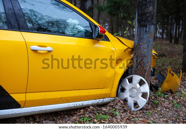 A\
taxi car crashed into a pole. A yellow car flew off the road. Car\
accident. Dangerous situation. The car frame is broken. Crumpled\
hood and broken wheels. The result of drunk\
driving.