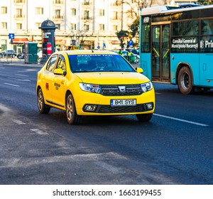 Taxi Car Dacia Logan In Traffic Of Downtown Bucharest, Romania, 2020.