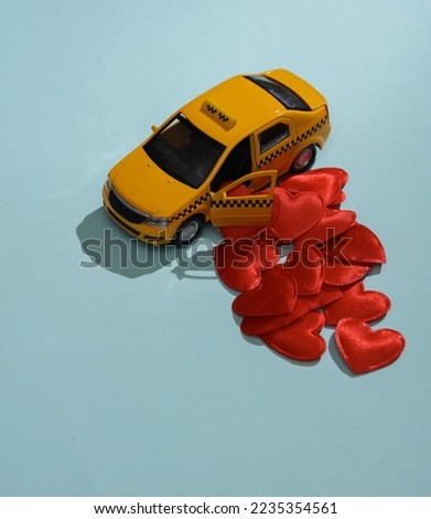 Taxi car with hearts on blue background. Love concept, valentine's day, february 14th celebration, creative layout