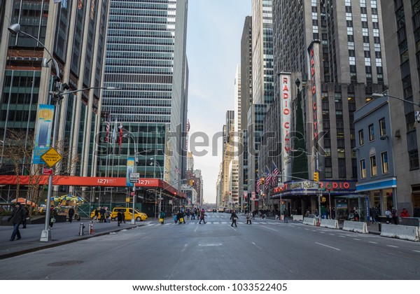 Taxi cars street, a busy tourist\
intersection of commerce Advertisements and a famous street of New\
York City and US, seen on Januar 3, 2018 in New\
York.