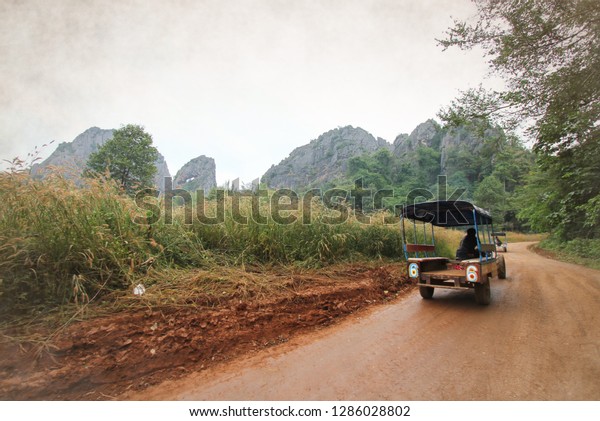 A taxi\
in the countryside that runs up the\
mountain