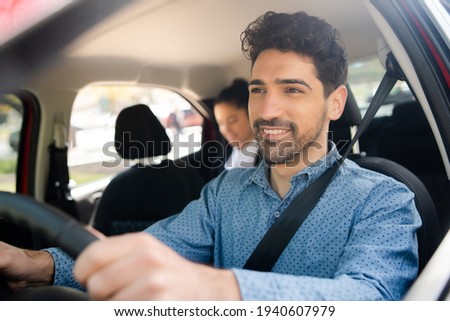 Similar – Image, Stock Photo man in driving car with arms out of the window