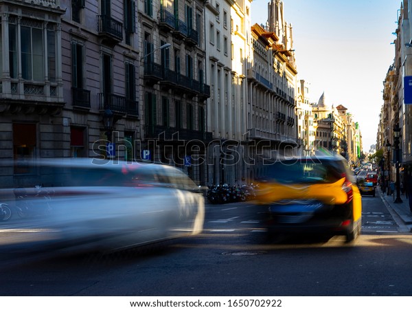 A taxi driving through the city. Taxi and\
traffic concept.