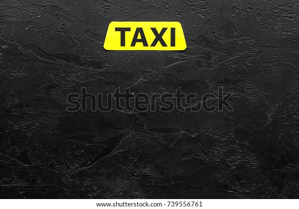 Taxi label\
on black background top view\
copyspace