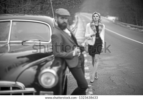 taxi on road with luxury couple. taxi driver and\
woman at retro car