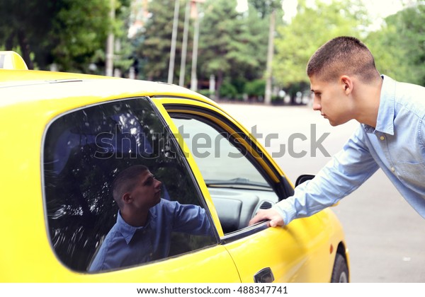 Taxi passenger near\
car