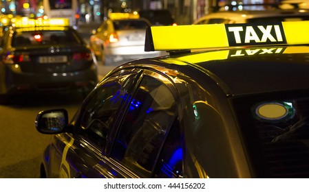 Taxi service in the city in the night.