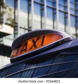 Taxi Sign On Cab In Canary Wharf, London