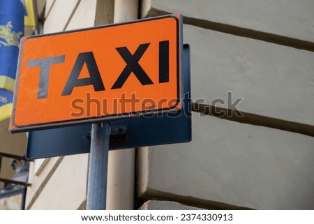 taxi sign road signage text street sign indicating the stopping and waiting station for car taxis
