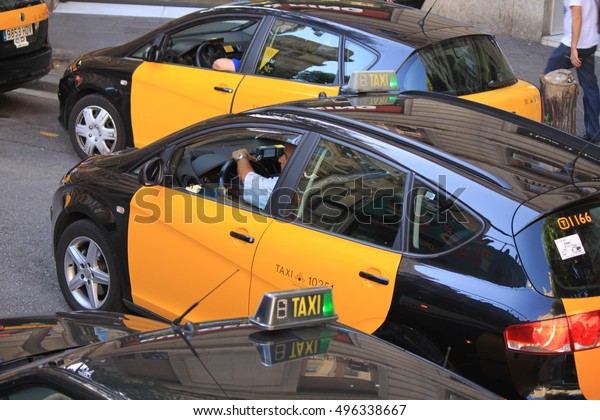   taxis of Barcelona.\
yellow-black taxis of Barcelona. Black and yellow taxi. City and\
municipal transport. Taxis are yellow and black taxis in\
Barcelona.