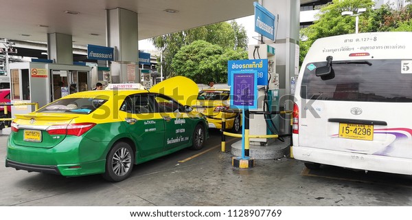 Taxis, cars and public service mini-vans\
line-up to fill their tank with alternative fuels like NGV and LPG\
gas in Bangkok, Thailand on 7th July\
2018