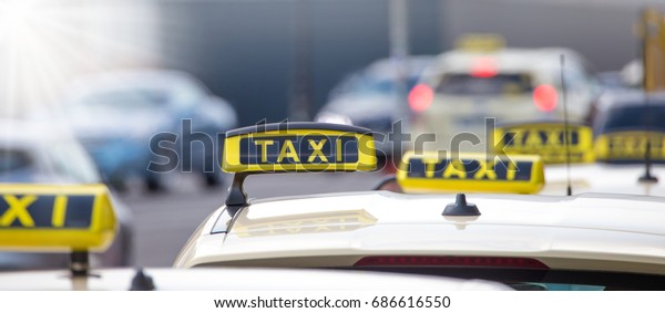 Taxis are waiting in\
a city for passengers