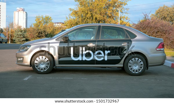taxis without jobs, empty streets. taxi cab car with\
Uber. taxi transportation service Minsk, Belarus, 06 September\
2019