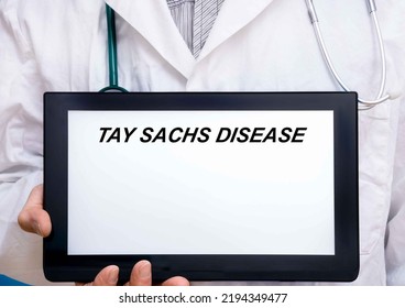 Tay Sachs Disease.  Doctor With Rare Or Orphan Disease Text On Tablet Screen Tay Sachs Disease