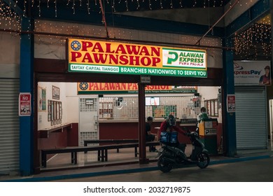 Taytay, Rizal, Philippines - Feb 2021: A Palawan Express and Pawnshop branch at Taytay Capital Tiangge.