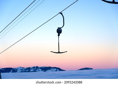 T-bar ski lift with beautiful colorful morning sky background at mountain village Stoos, Canton Schwyz. Photo taken December 21st, 2021, Stoos, Switzerland.