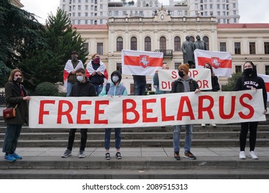 Tbilisi, Georgia - 01.12.2021  Free Belarus the rally in Solidarity with Belarus. People rallying and marching towards Independence Avenue, Flag of Belarus. White red white