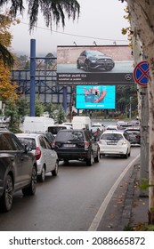 Tbilisi, Georgia - 30.11.2021 Car Rush Hours City Street. Cars On Highway In Traffic Jam, Billboard On The Road