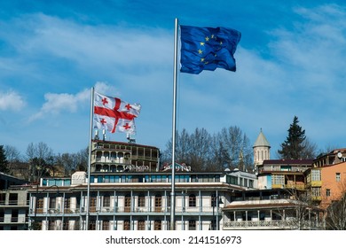 Tbilisi, Georgia - 31.03.2022 Georgian And European Union Flag In Square And Background Castle