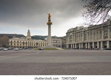 TBILISI, GEORGIA - MARCH 29, 2011: Liberty square with St George statue and Tbilisi city assembly on the background