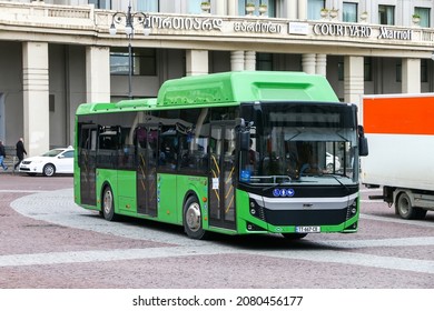 Tbilisi, Georgia - October 10, 2021: Green CNG powered city bus BMC Procity 12 LF CNG in a city street.