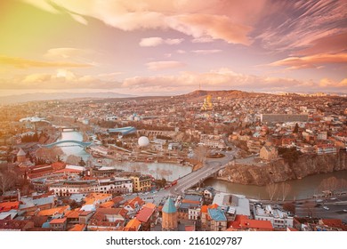 Tbilisi, Georgia. Top View Of Famous Landmarks In Spring Sunset Evening. Georgian Capital Skyline Cityscape. Justice House, Bridge Of Peace, Concert Hall, Rike Park And Presidential Palace, Metekhi,