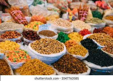 Tbilisi, Georgia. View Of Persian English Common Walnut (Juglans Regia), Succade And Dried Fruits In Bags On Showcase Of Local Food Market.