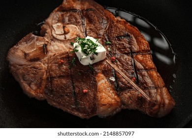 T-bone Steak Cooked In A Grill Pan With Spices And Butter. Premium Beef Steak On The Bone Close-up