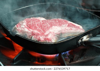 T-bone steak cooking in the pan                             - Powered by Shutterstock