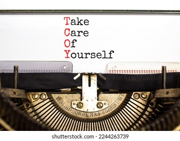 TCOY take care of yourself symbol. Concept words TCOY take care of yourself typed on retro typewriter on beautiful white background. Business TCOY take care of yourself concept. Copy space.