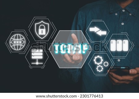 TCP IP, Network data transmission model concept, Person hand using smartphone and hand touching tcp ip icon on virtual screen.