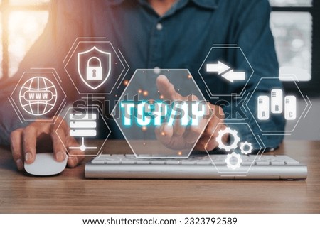 TCP IP, Network data transmission model concept, Person hand using computer and hand touching tcp ip icon on virtual screen.