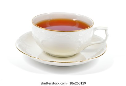 Tea in antique porcelain cup isolated on white background. Porcelain cup and saucer with delicate relief structures and gold decoration.